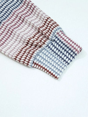 Relaxed fit hoodie sleeve with a multi-tonal houndstooth pattern in navy, burgundy, and grey.