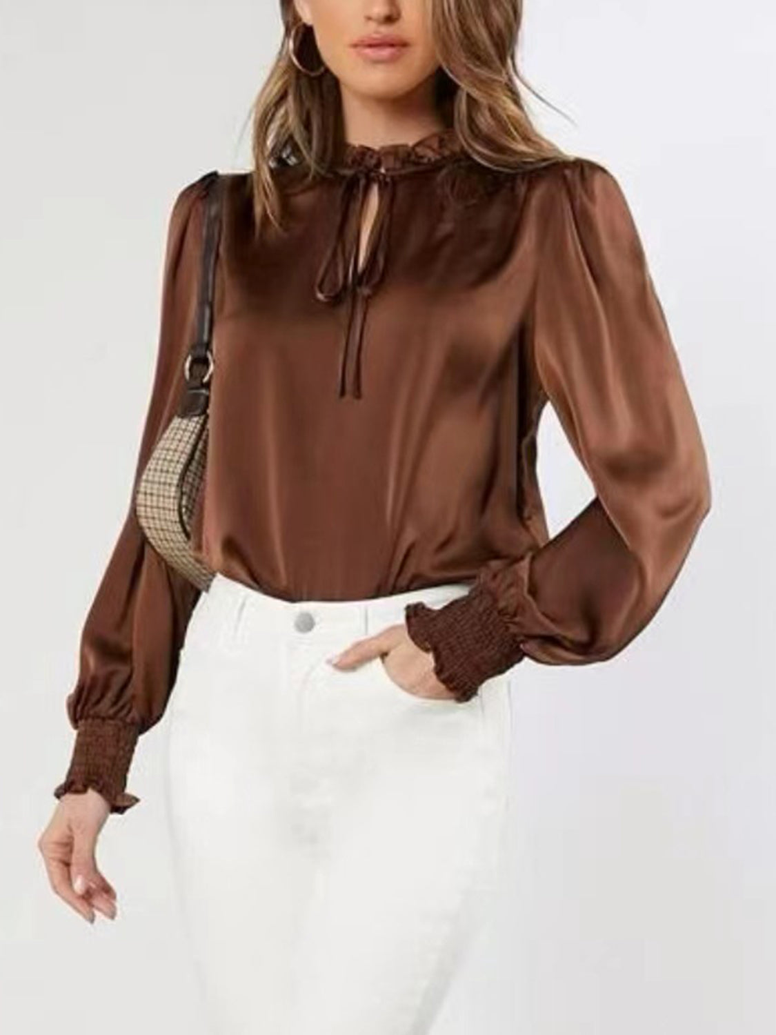 Brown satin tie-neck blouse with shirred cuffs and ruffled collar