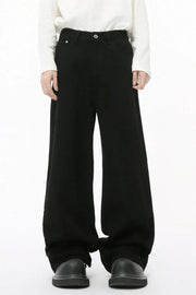 Black balloon leg jeans with a faded wash and wide silhouette.