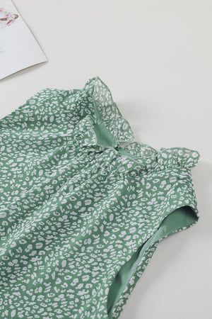 Sage green sleeveless blouse with white leopard print and ruffled neckline.