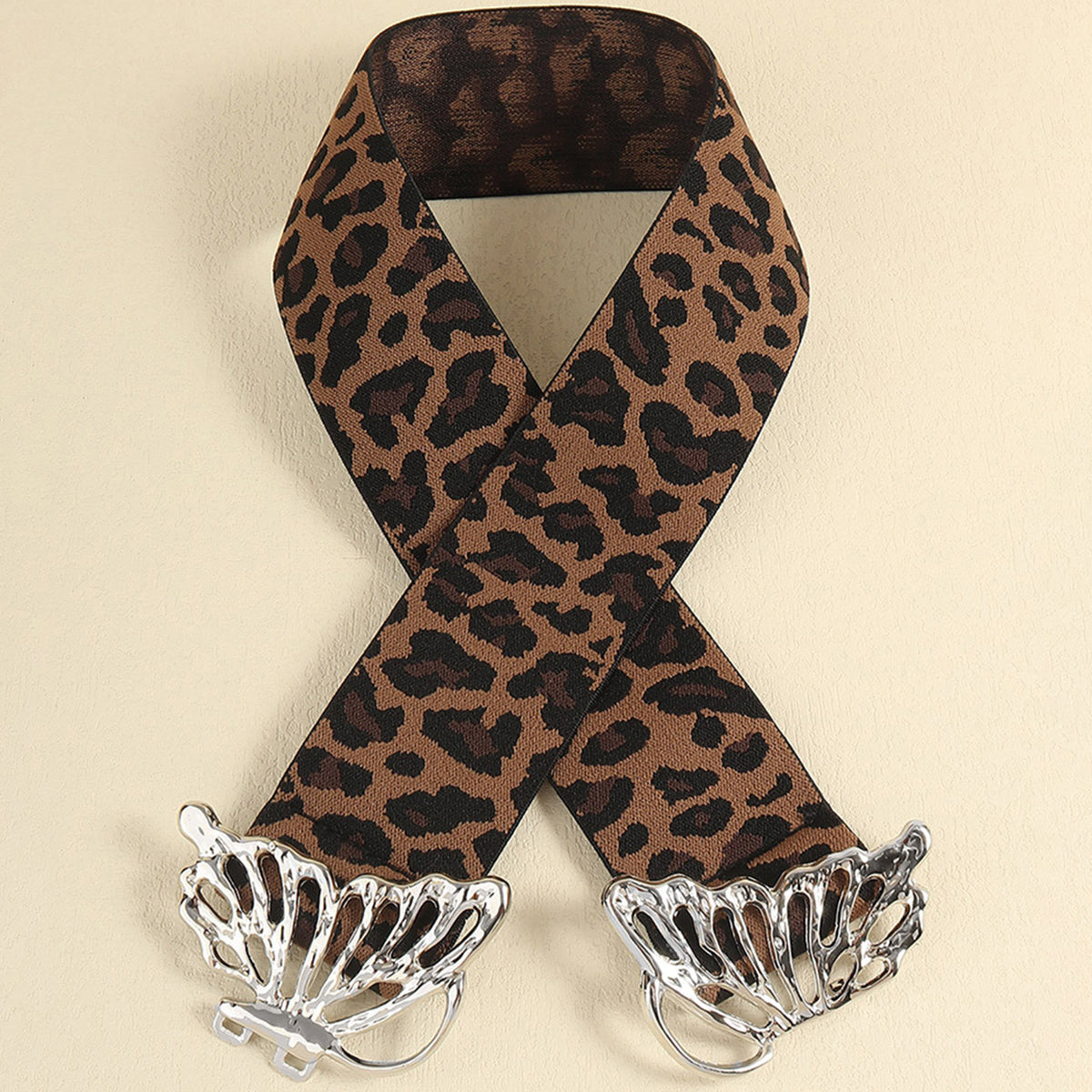 Leopard print elastic belt with silver butterfly buckle detail