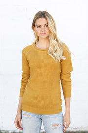Yellow honeycomb knit pullover sweater with crew neck and raglan sleeves.