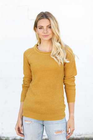 Yellow honeycomb knit pullover sweater with crew neck and raglan sleeves.