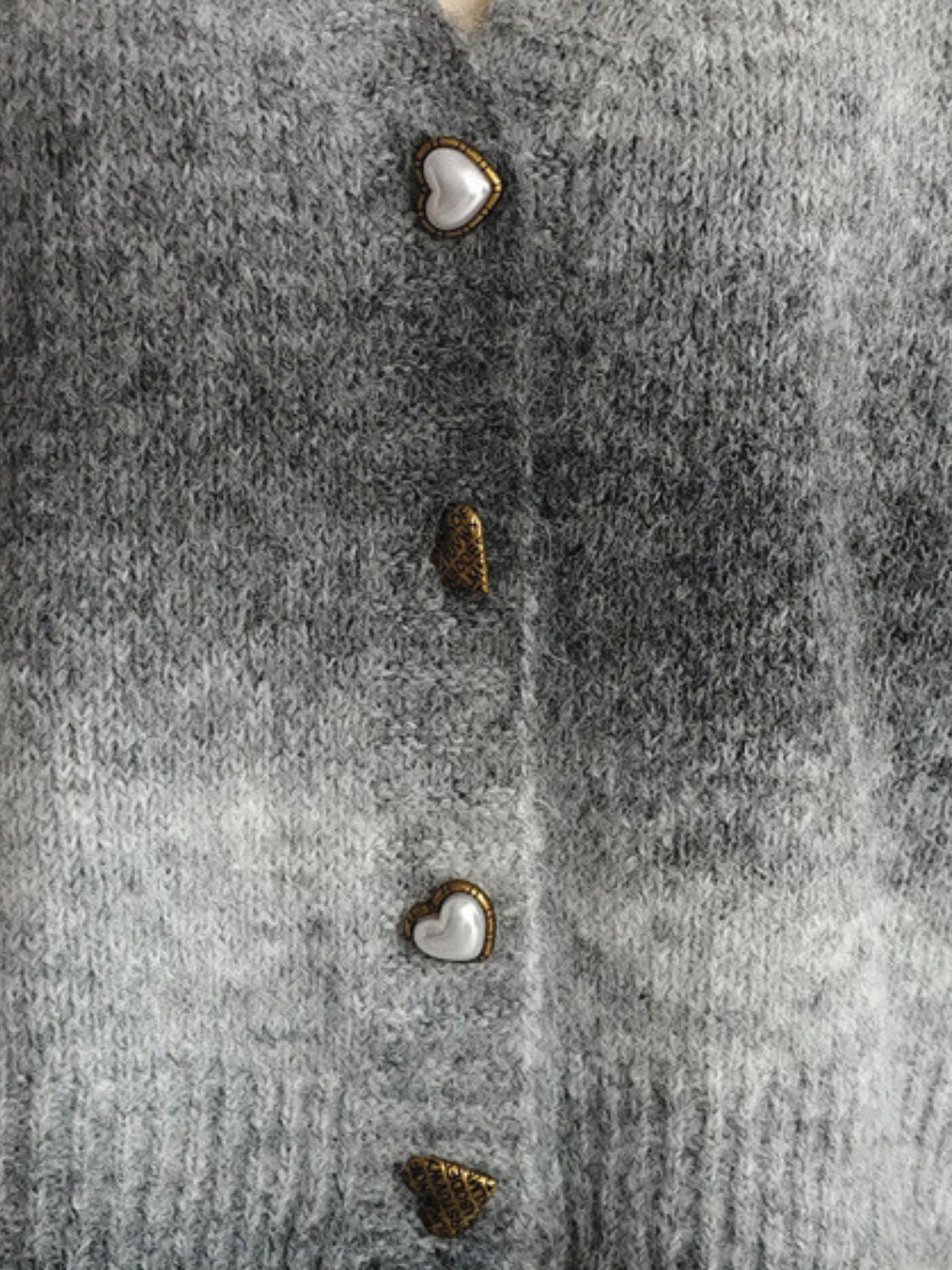 Gray ombre knit cardigan with heart buttons and textured buttons.