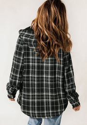 Sherpa-lined plaid overshirt jacket in black with button cuffs and a hood.
