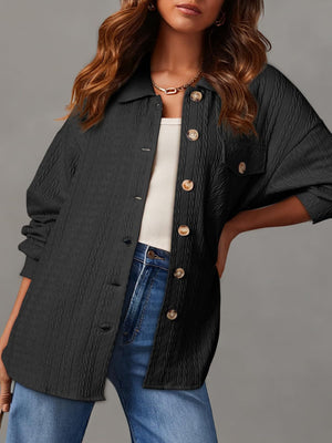 Black textured oversized button-down shacket with a collared neckline and button closure.