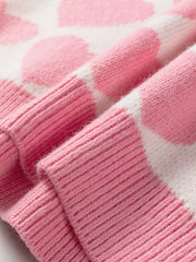 Charming Heart Pattern Knit Sweater in blush pink and white acrylic, featuring ribbed cuffs and hem detail.
