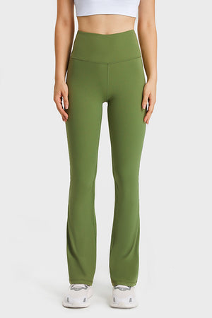 Green flare yoga pants with a high waist and breathable fabric.