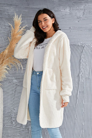 Cream plush hooded duster with thumbhole cuffs and pockets.