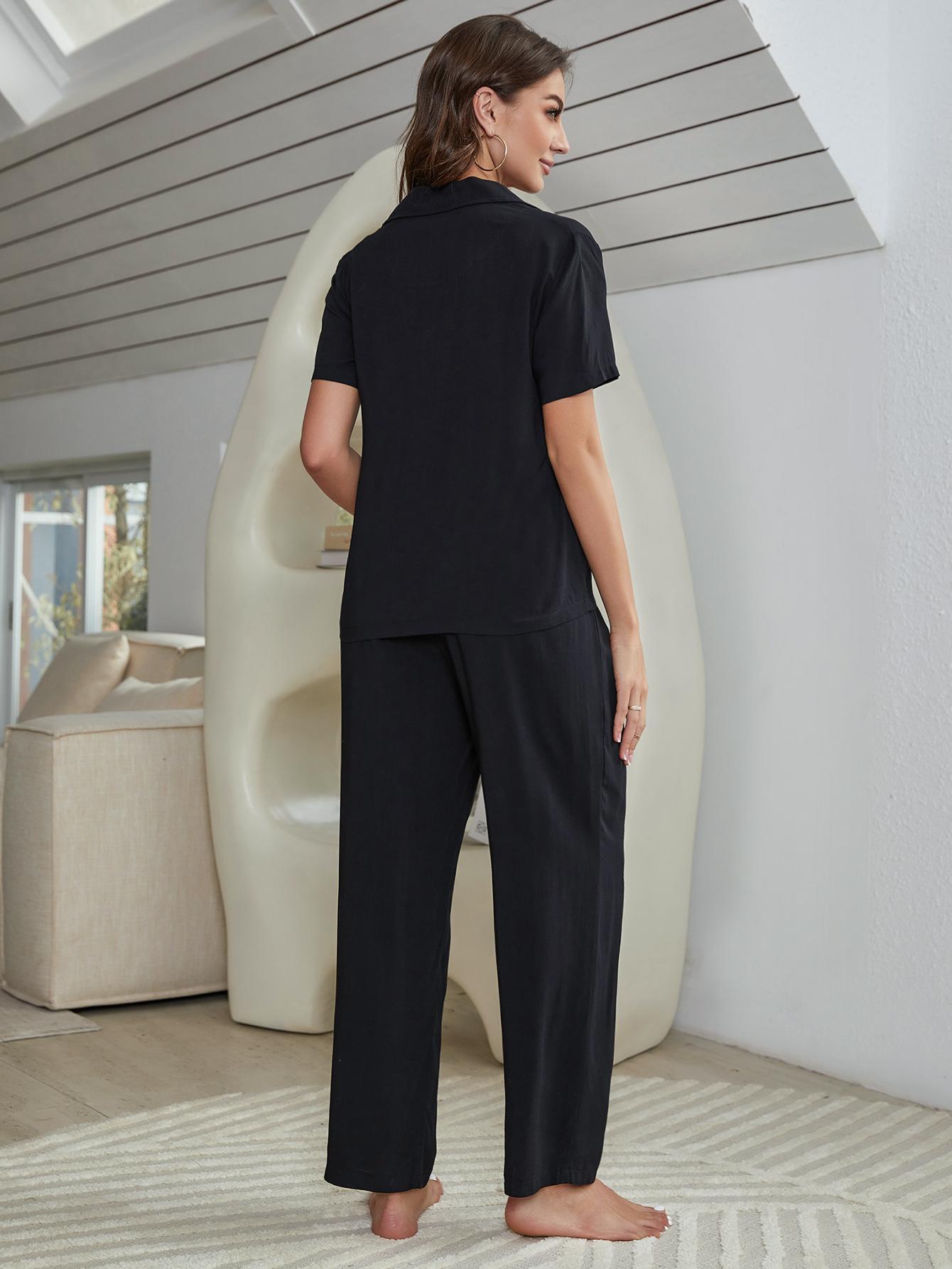 Black silk-blend lounge shirt and pants set with a collared neckline and short sleeves.