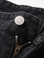 Black denim jeans with button and zipper detail