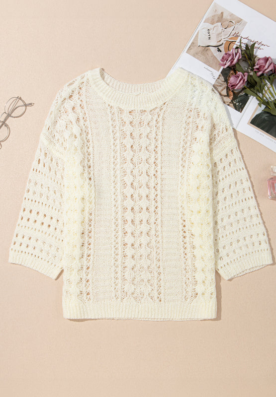 Beige openwork knit beach cover-up with 3/4 sleeves and crew neck.