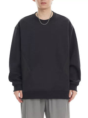 Black oversized cotton crew-neck sweatshirt with textured panel detail.
