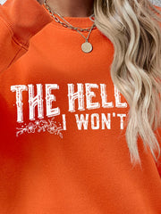 Graphic crewneck sweatshirt in Pumpkin with white text and floral detail.