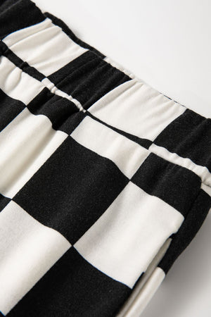 Black and white checkered pants with elastic waistband detail