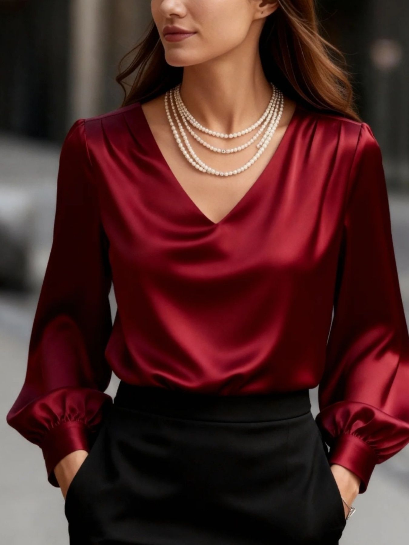 Red satin V-neck long sleeve blouse with balloon sleeves and gathered cuffs.