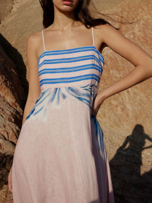 Pink spaghetti strap maxi dress with blue abstract stripes and watercolor print
