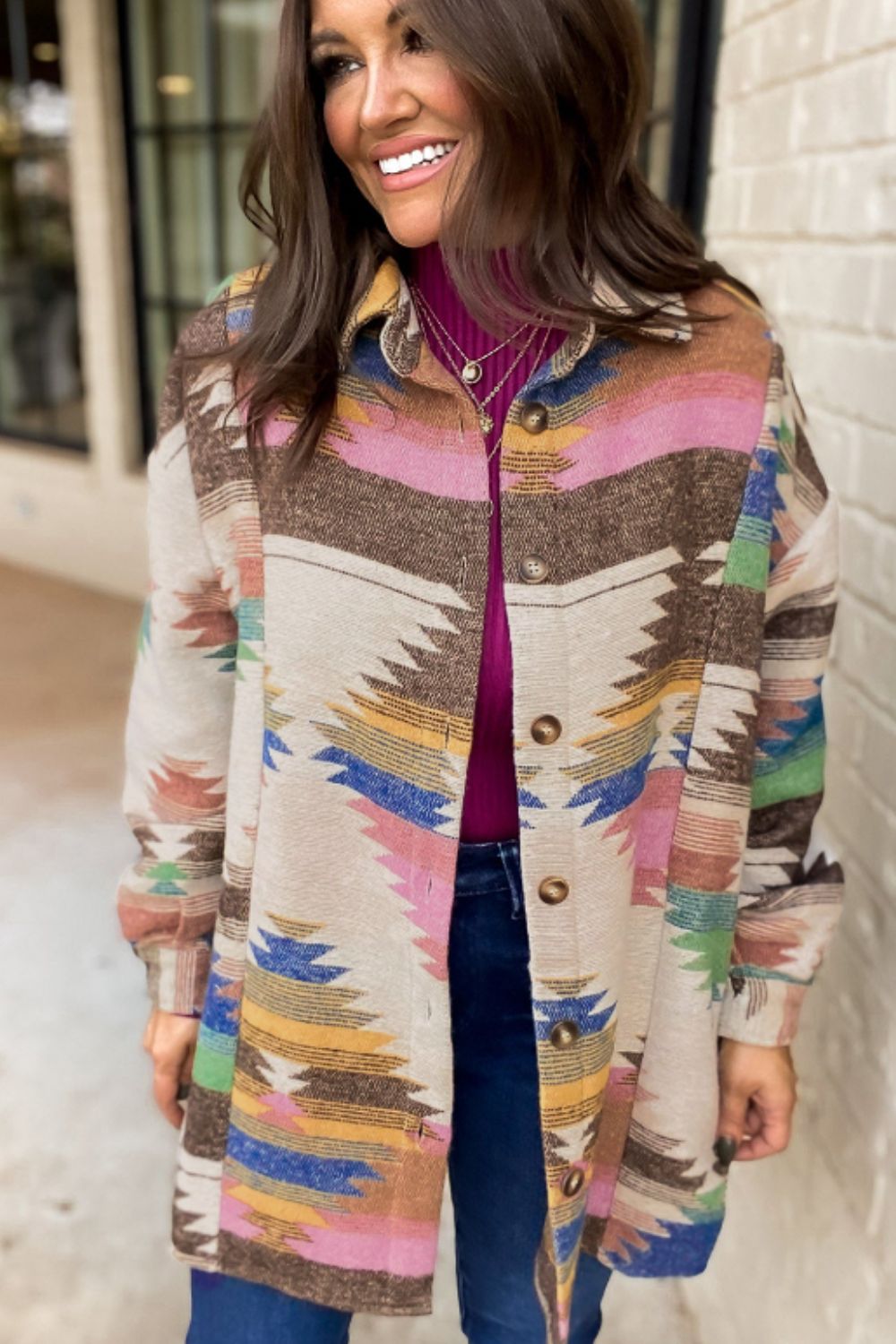Southwestern print shirt jacket in beige with button front and colorful geometric pattern.