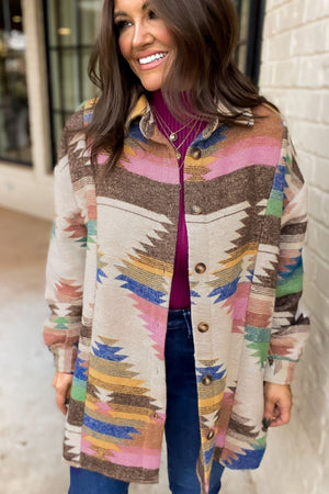 Southwestern print shirt jacket in beige with button front and colorful geometric pattern.