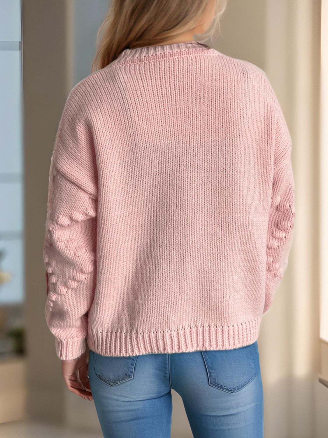Dusty Pink knit cardigan with strawberry patchwork detail on sleeves.