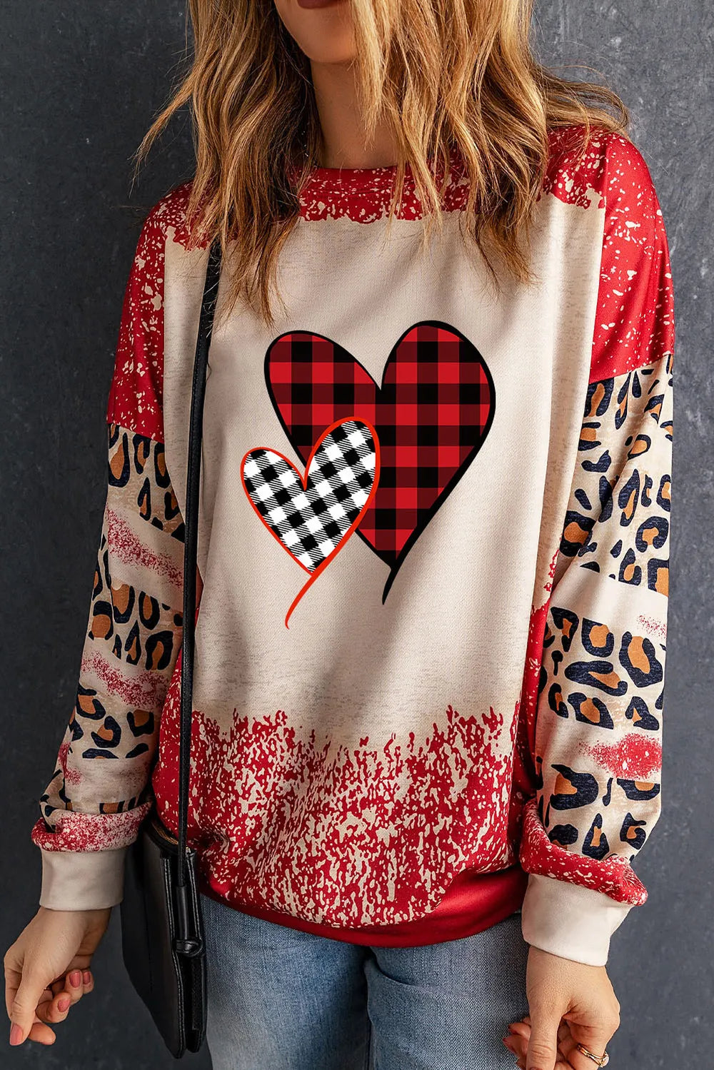 Plaid Heart Graphic Leopard Sleeve Sweatshirt in Deep Red with graphic hearts and animal print sleeves.