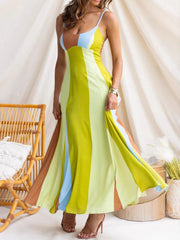 Vibrant color block maxi dress with spaghetti straps and high slits in yellow, blue, and brown hues.