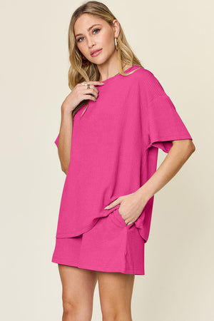 Waffle knit boxy tee and shorts set in hot pink with short sleeves and pockets.