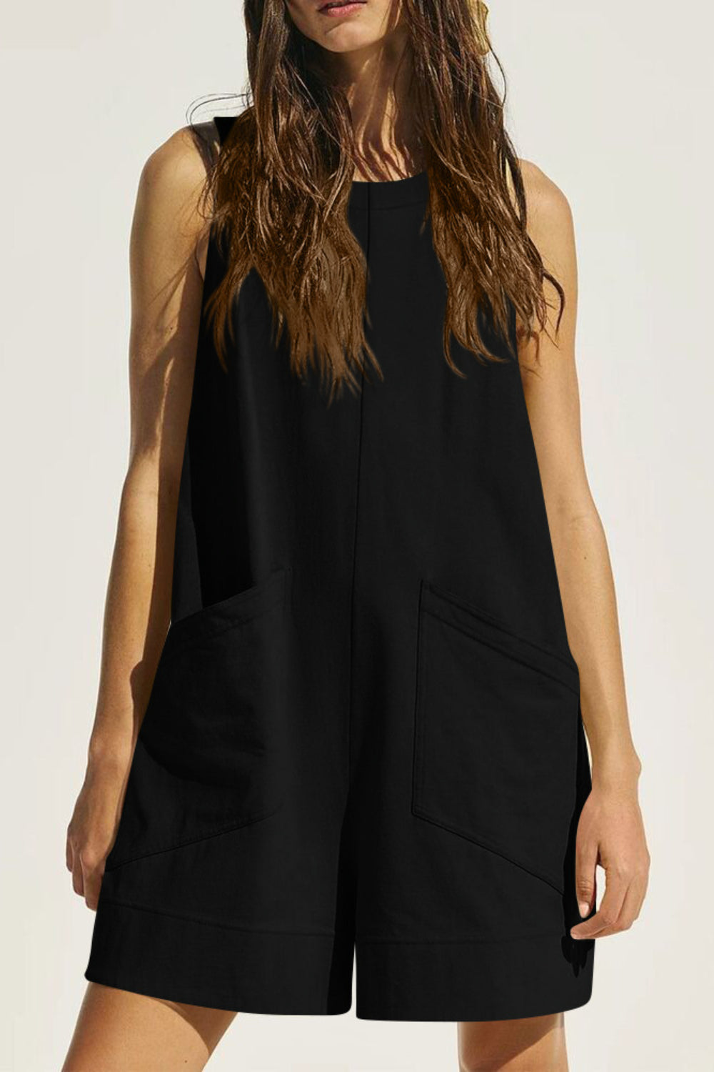 Black relaxed fit linen romper with pockets and round neckline