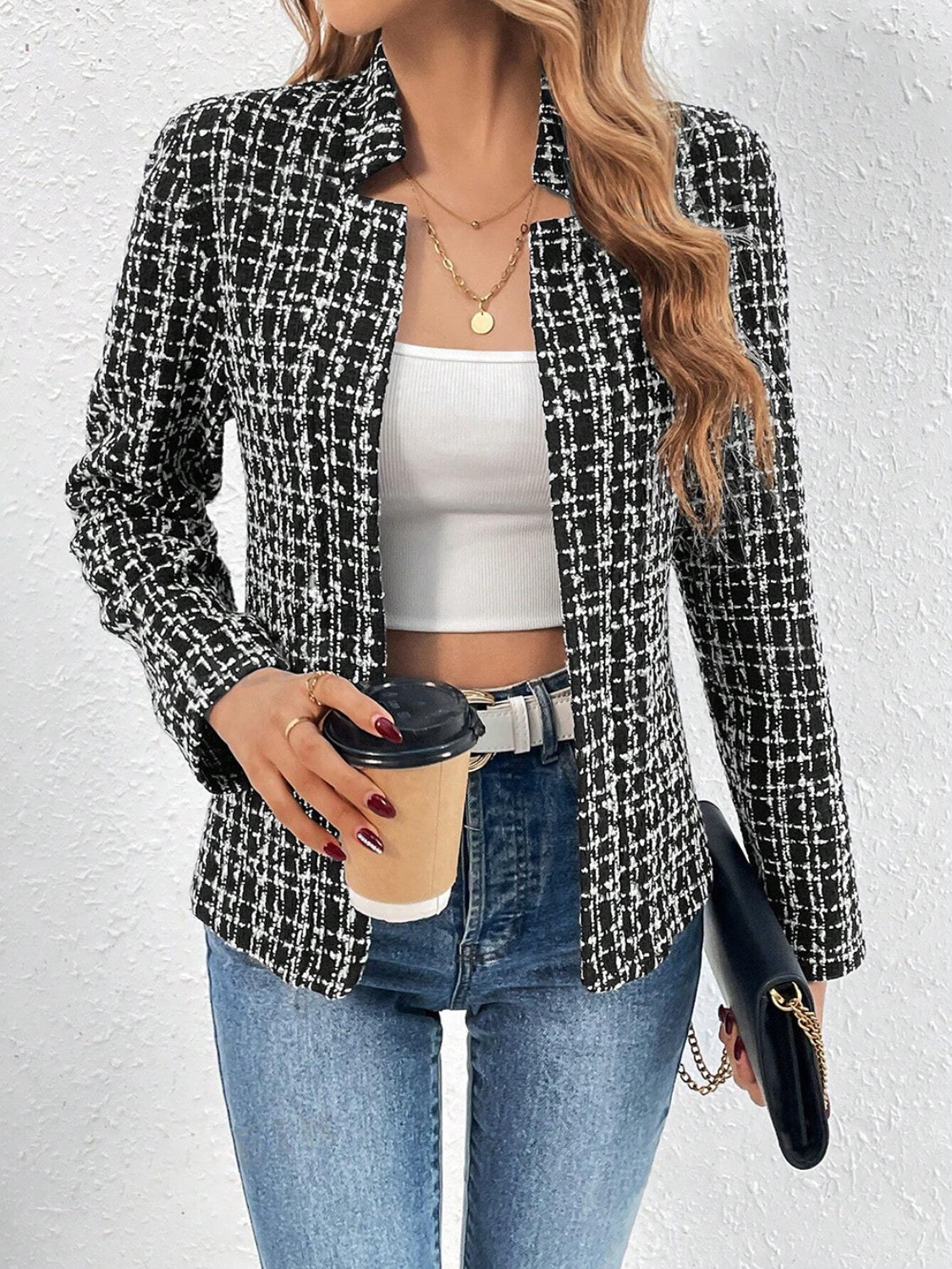 Black and white textured tweed open-front blazer with a plaid pattern.