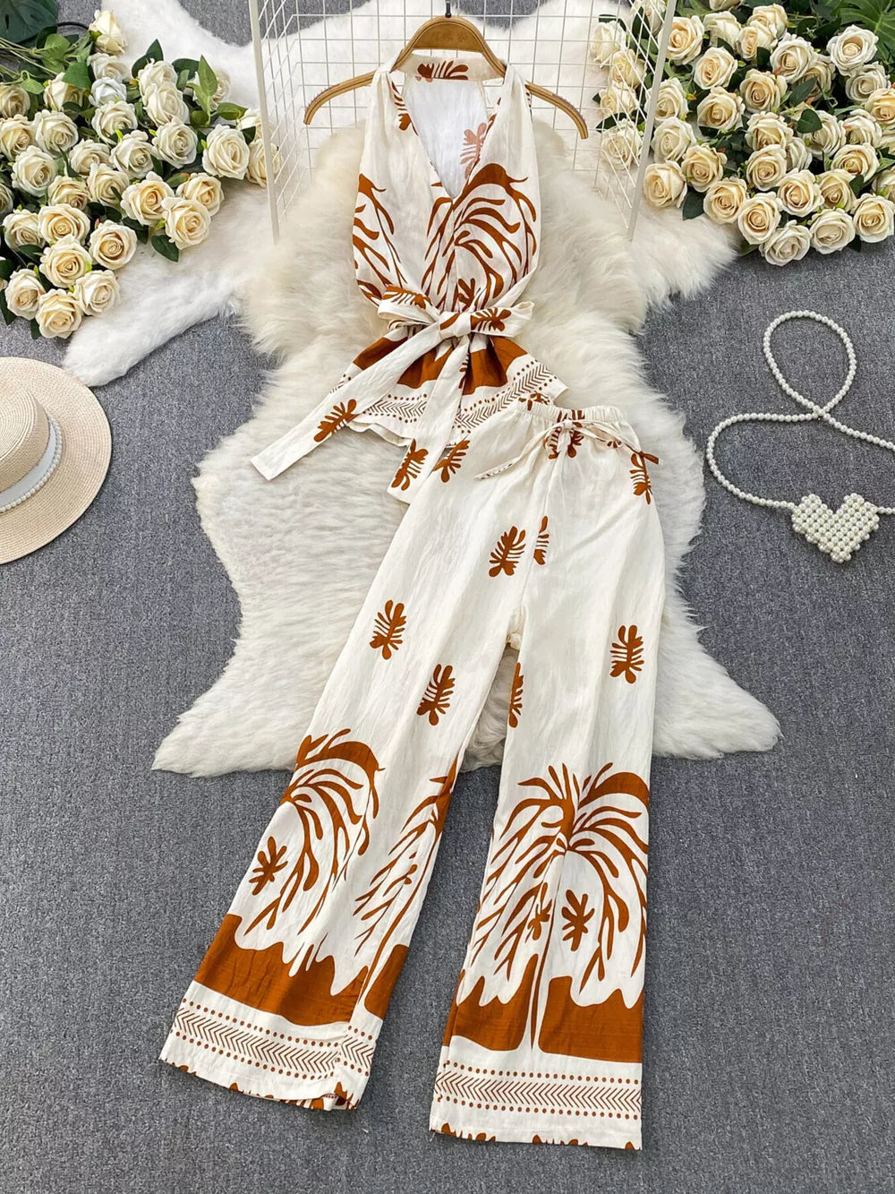 Tropical print two-piece set with belted detail in white and brown polyester.