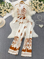 Tropical print two-piece set with belted detail in white and brown polyester.