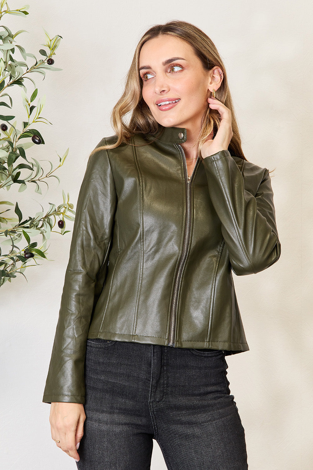 Army green faux leather biker jacket with zip front and stand collar.