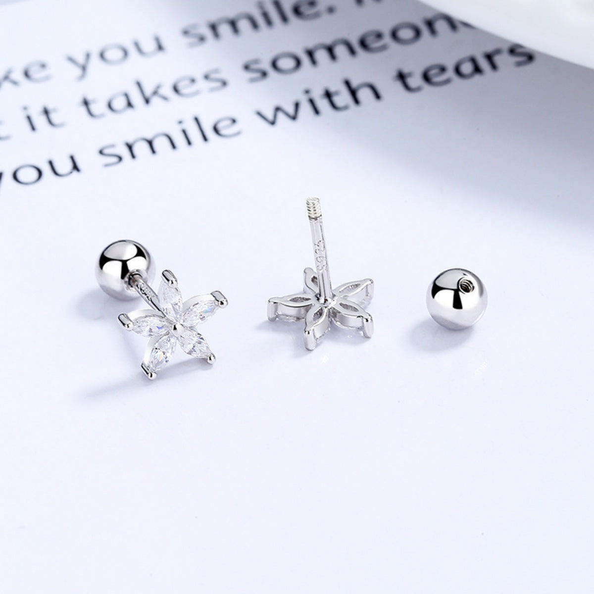 Silver flower stud earrings with clear cubic zirconia, 925 sterling.