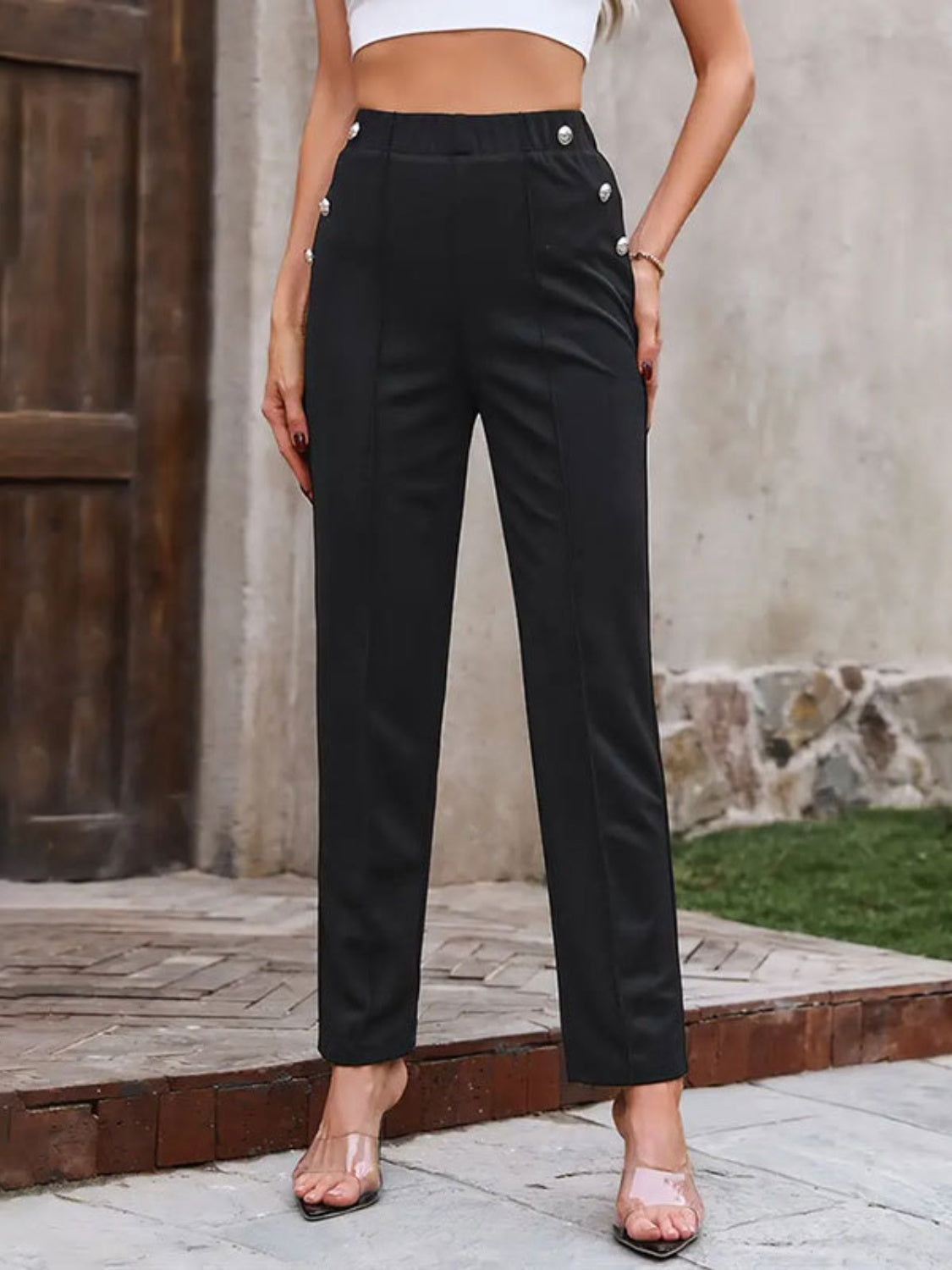 Black tailored trousers with elastic waist and button detail