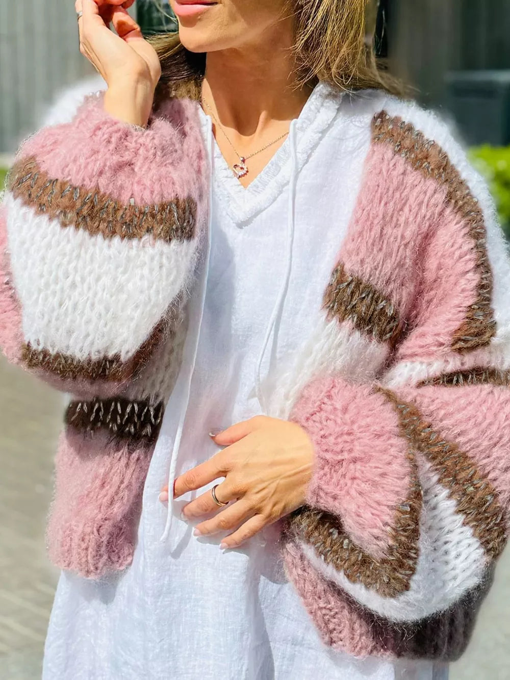 Chic color block open cardigan in acrylic with balloon sleeves and a relaxed fit.