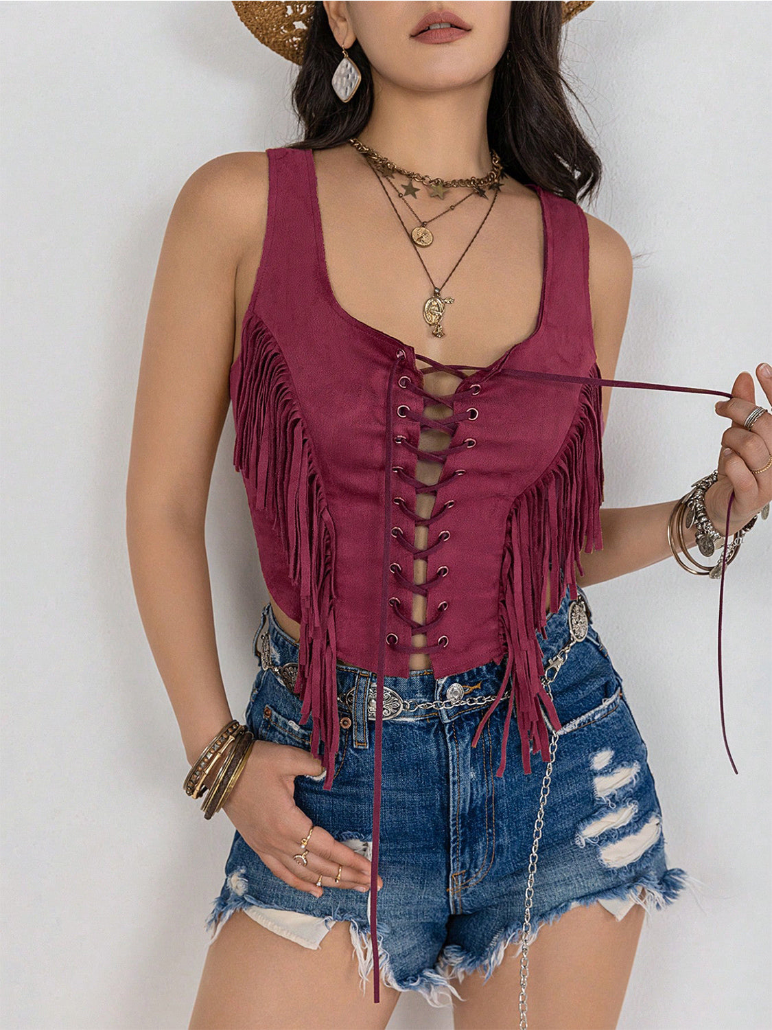 Cerise suede fringe corset vest with lace-up front detail
