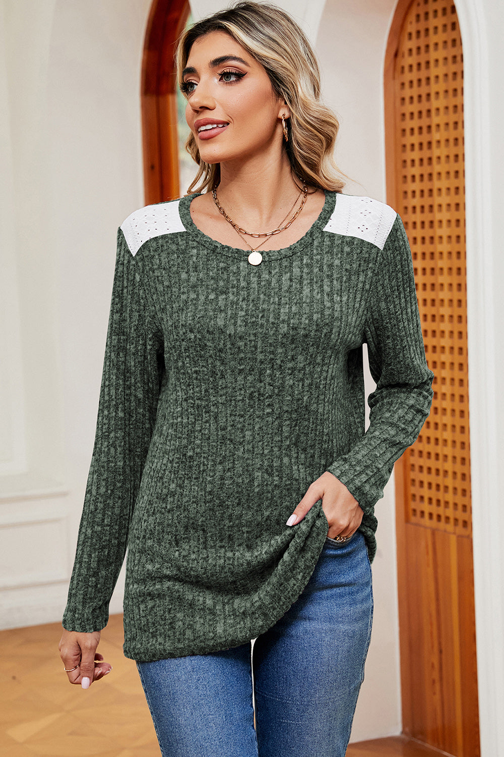 Matcha green ribbed knit top with eyelet shoulder detail and crew neck.