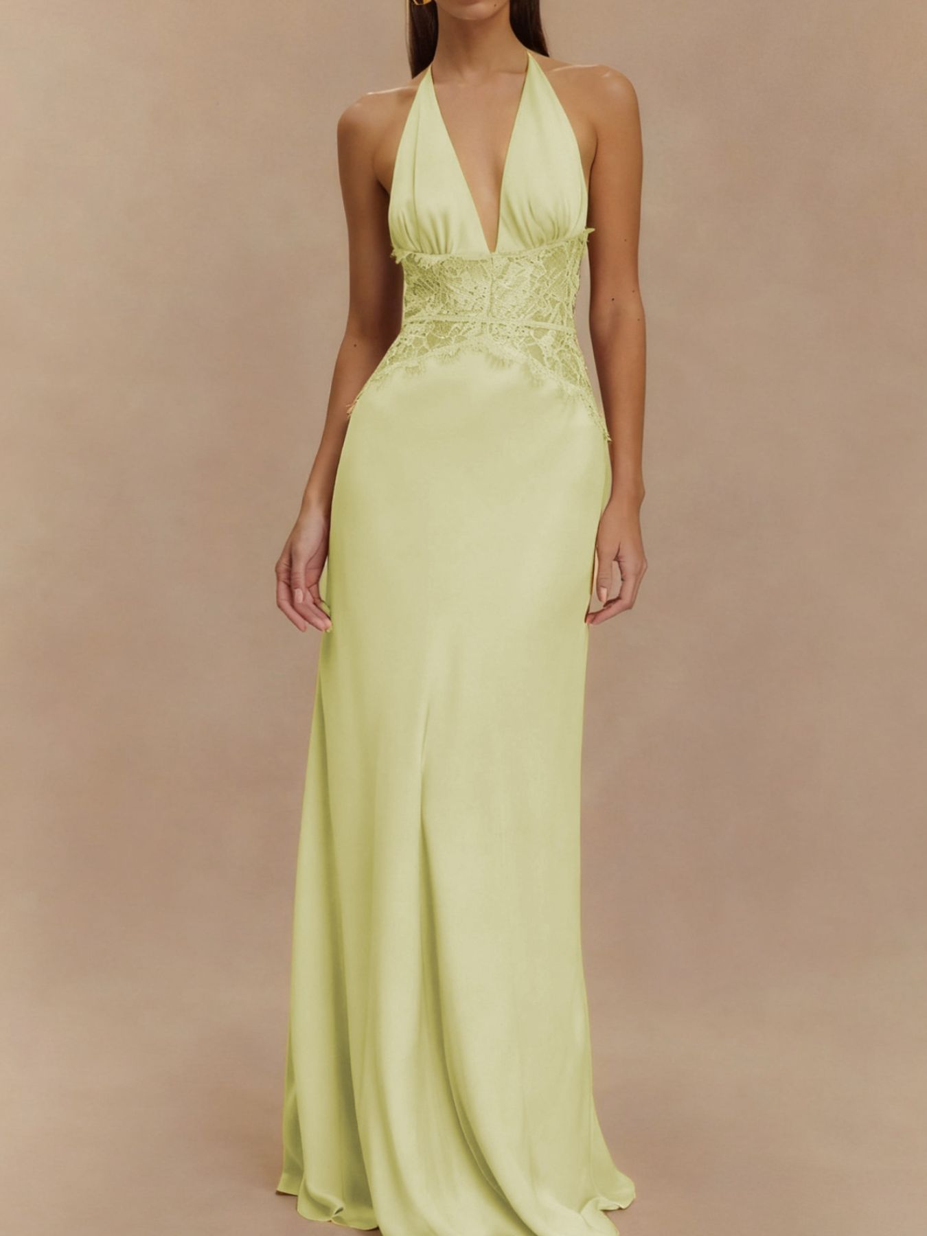 Light yellow halter neck maxi dress with lace trim detail and plunging neckline.