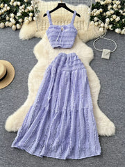 Purple ruched crop top and maxi skirt set with tie detail.