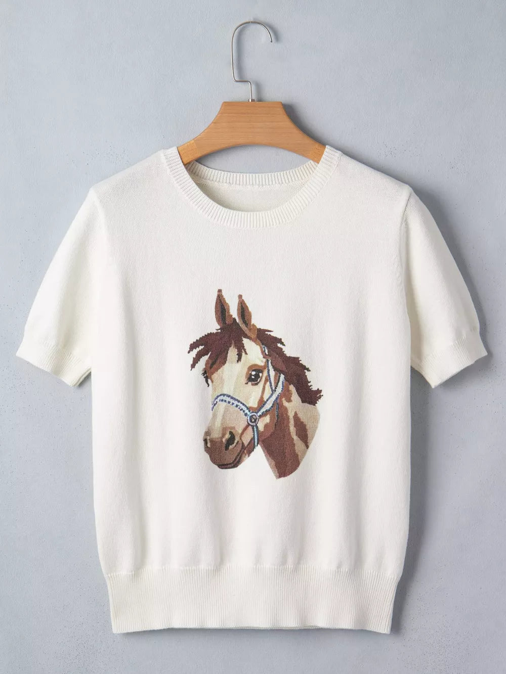 White short-sleeve sweater with horse head graphic and blue halter, acrylic and cotton blend