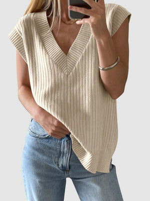 Tan ribbed knit V-neck sleeveless sweater with a relaxed fit.