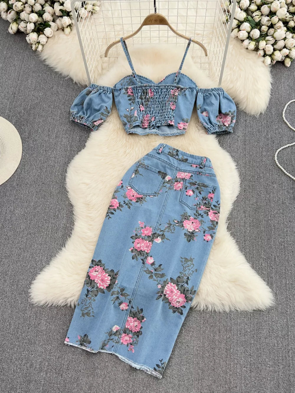 Denim sweetheart cami with off-shoulder sleeves and floral print skirt set.
