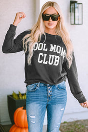Charcoal crewneck sweatshirt with white "Cool Mom Club" graphic, casual long sleeves, relaxed fit.