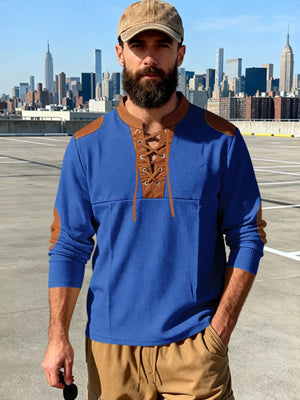 Blue long-sleeve men's t-shirt with lace-up neckline and brown shoulder patches.