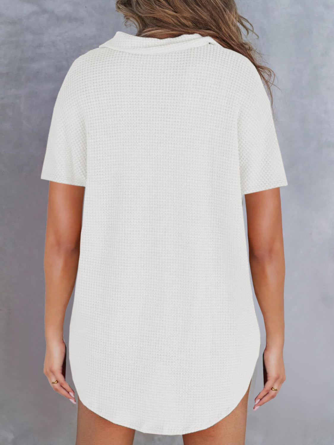 White waffle knit polo shirt with button detail and short sleeves