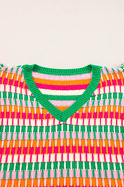 Geometric knit v-neck top in green, orange, pink, and white stripes with flutter sleeves.