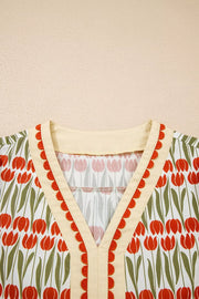 Cotton mini dress with vibrant red tulip print, V-neck and scalloped trim.