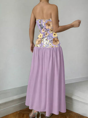 Strapless maxi dress in lavender with floral embroidered bodice and flowing skirt.