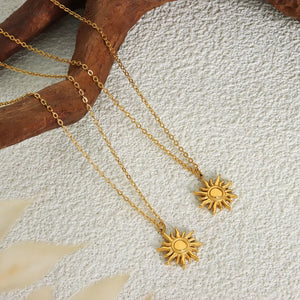 Golden sunburst pendant necklace, 18K gold-plated adjustable chain.