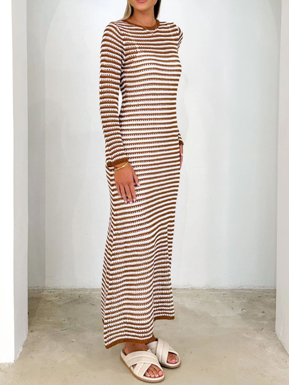 Caramel and white striped maxi sweater dress with long sleeves and a crew neck.
